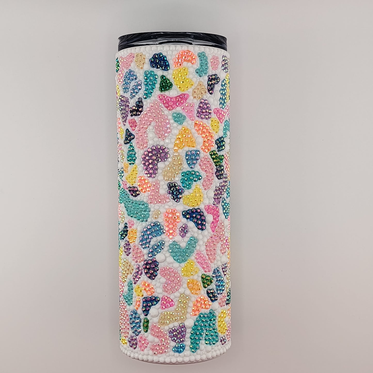 Tumbler with colorful terazzo pattern on a gray background